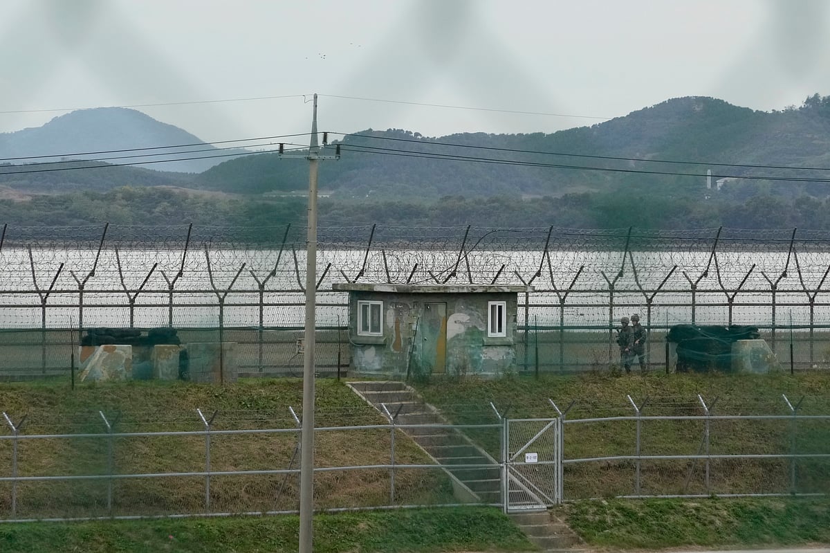 South Korean army soldiers patrol along the barbed-wire fence in Paju, South Korea, near the border with North Korea, Monday, Oct. 14, 2024. - AP