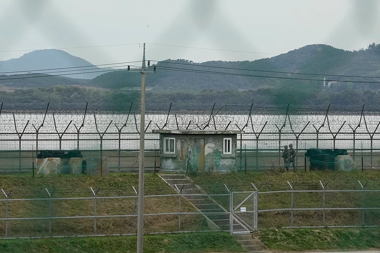 South Korean army soldiers patrol along the barbed-wire fence in Paju, South Korea, near the border with North Korea, Monday, Oct. 14, 2024. - AP