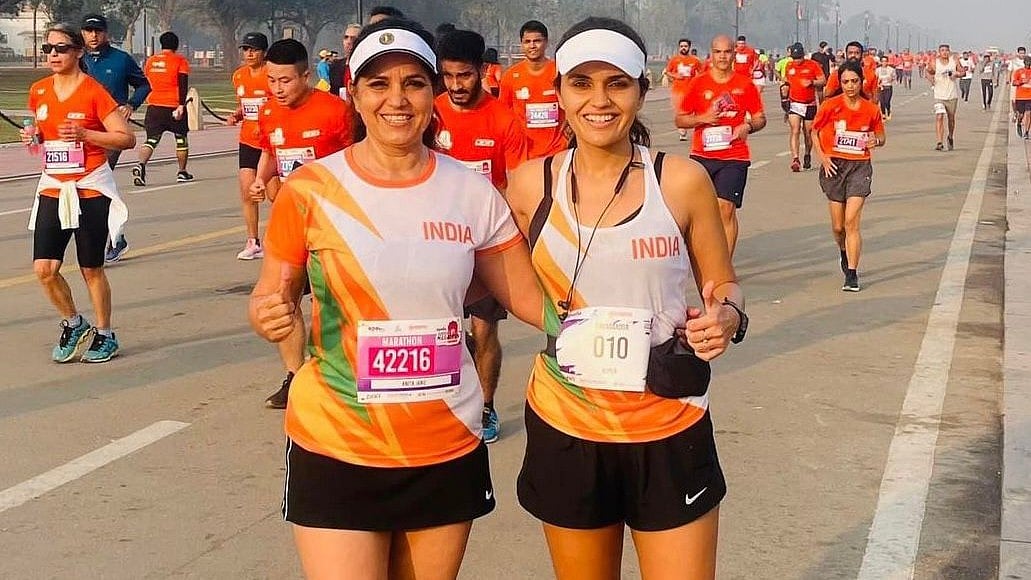 Anita Janu (left) with daughter Nupur after completing yet another marathon. - Special Arrangement