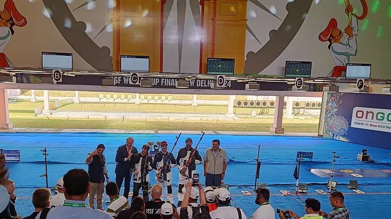 India's shooter Akhil Sheoran (R) with officials and competitors at the ISSF Shooting World Cup 2024. - Photo: Outlook | Jagdish Yadav