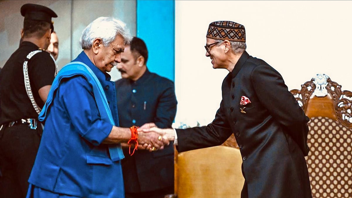 PTI : Jammu and Kashmir Lieutenant Governor Manoj Sinha being greeted by CM-designate Omar Abdullah before the latter's swearing-in ceremony, in Srinagar. 