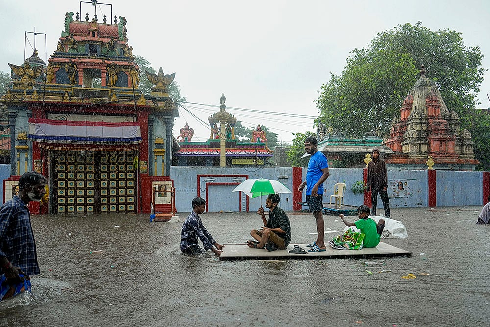 | Photo: PTI/R Senthilkumar : Tamil Nadu Rains: Waterlogged area at Pattalam in Chennai