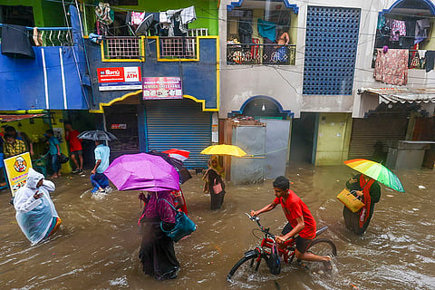 Tamil Nadu Rains: People wade through waterlogged road
