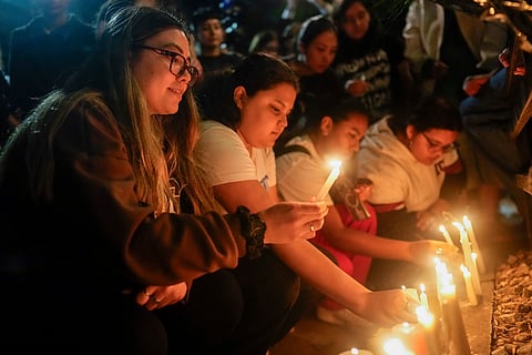 Fans pay tribute to Payne outside the hotel in Palermo |