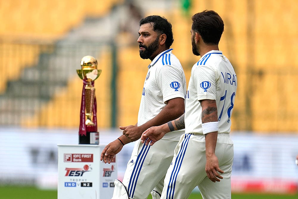 | Photo: AP/Aijaz Rahi : IND Vs NZ 1st Test: India's captain Rohit Sharma, left, and Virat Kohli walk into the field