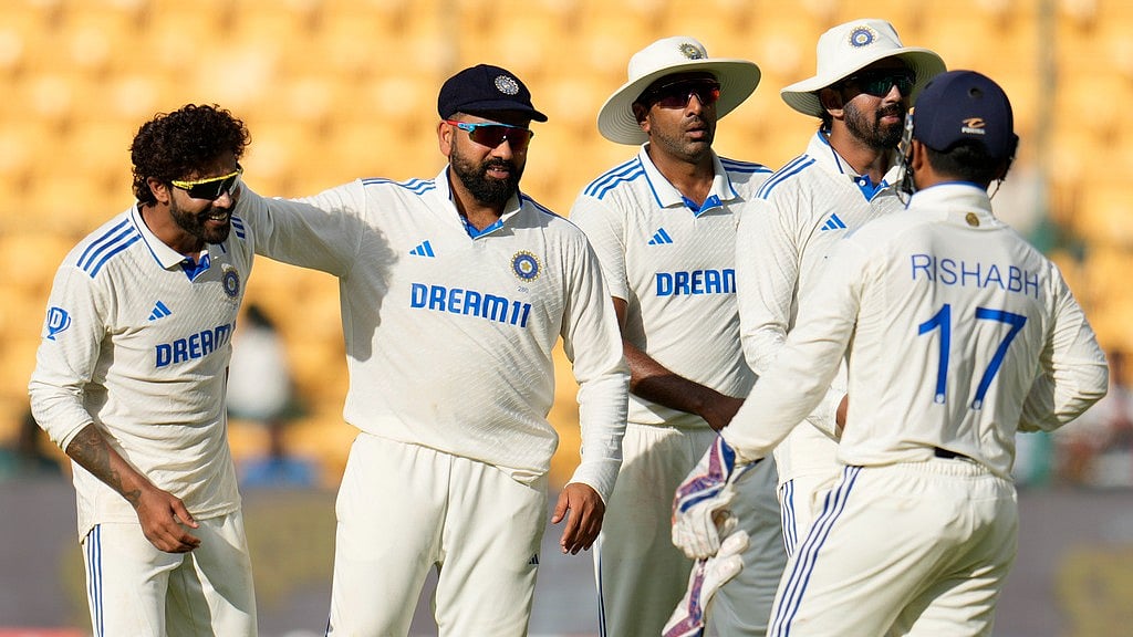 IND vs NZ, 1st Test: Ravindra Jadeja (left) celebrates the fall of Will Young with his Indian teammates. - AP/Aijaz Rahi