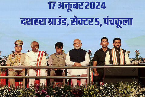 Haryana CM oath ceremony: PM Narendra Modi with Haryana Governor Bandaru Dattatreya and CM-designate Nayab Saini 