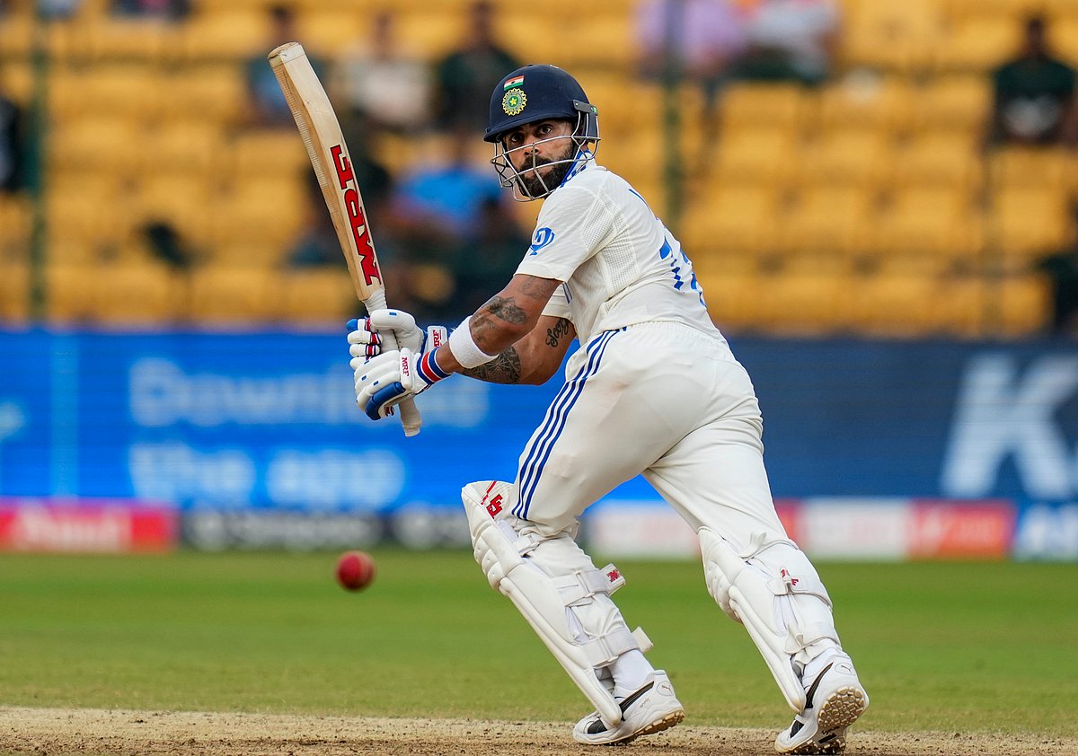 | Photo: PTI/Shailendra Bhojak : IND Vs NZ 1st Test: Virat Kohli plays a shot on the third day of the first test