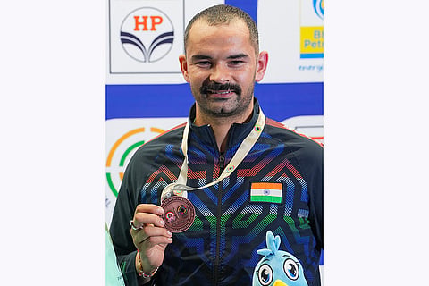 ISSF World Cup: Akhil Sheoran of India poses with his bronze medal 