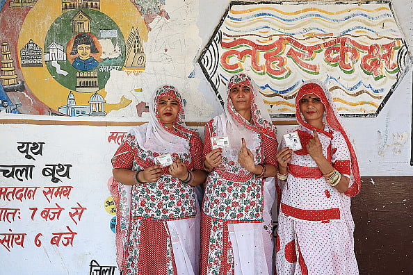 Getty Images : Women displaying their fingers marked with indelible ink after voting in the 2nd phase of Lok Sabha elections in Dudu district, Rajasthan