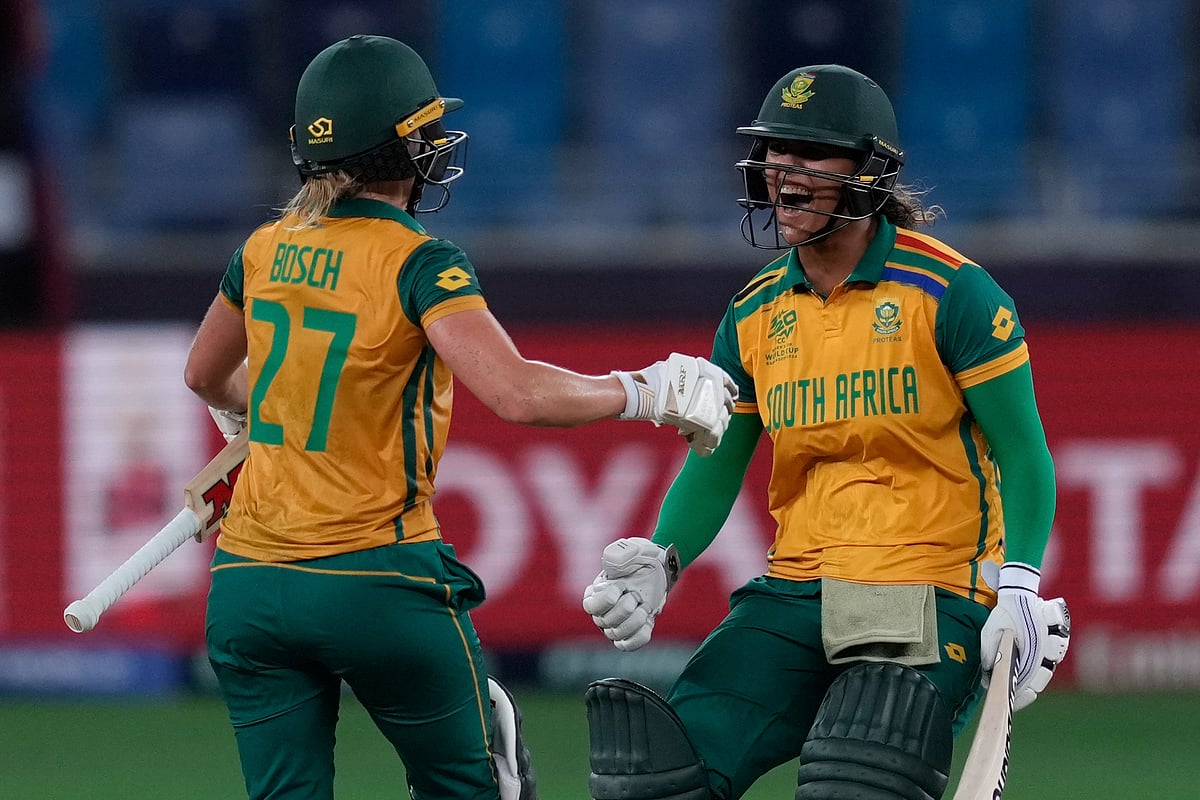 (AP Photo/Altaf Qadri) : South Africa's Anneke Bosch and Chloé Tryon celebrate after wining against Australia during the ICC Women's T20 World Cup 2024 semi-final match at Dubai International Cricket Stadium, United Arab Emirates, Thursday, Oct. 17, 2024. 