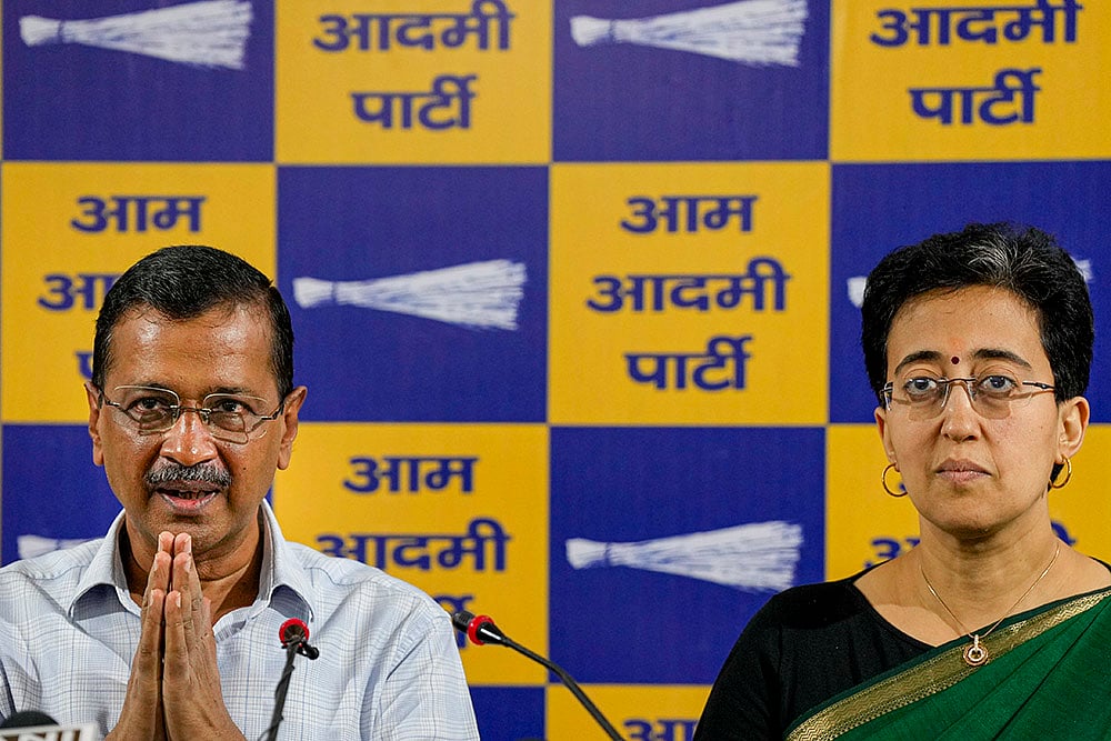 Atishi and Arvind Kejriwal during AAP press conference