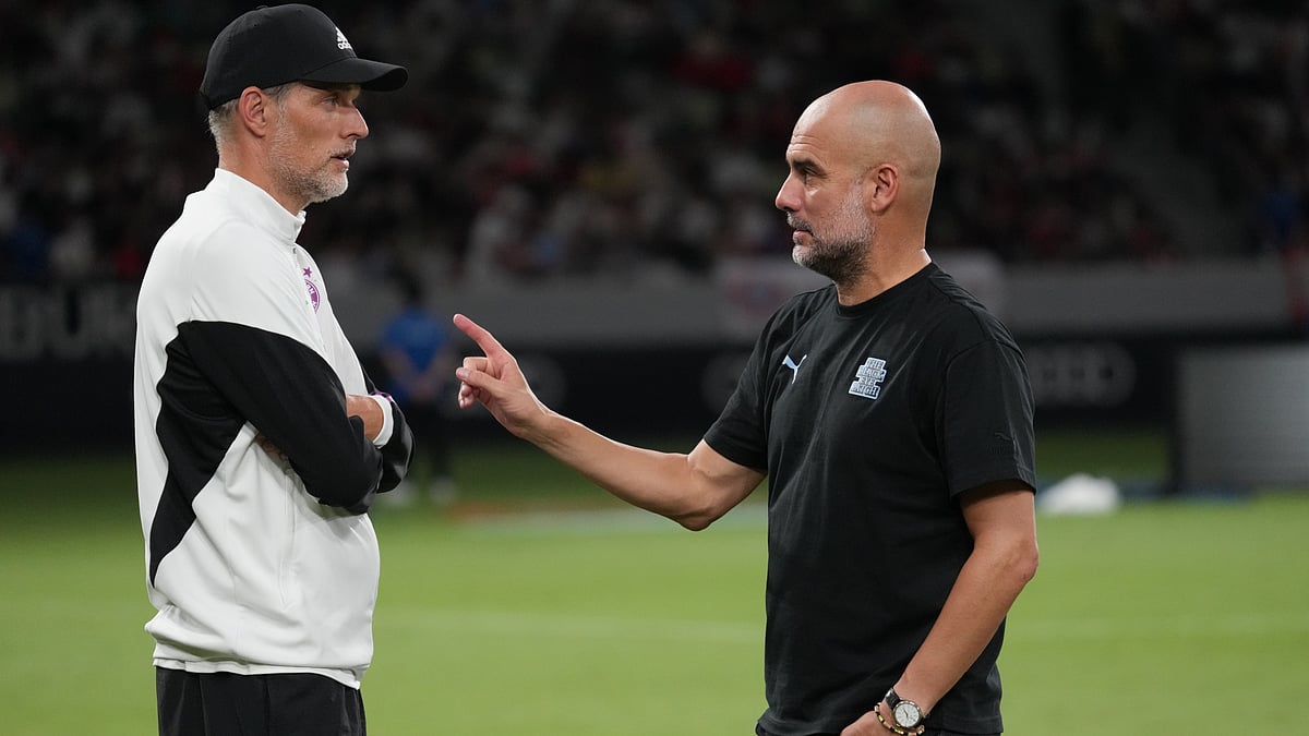 Pep Guardiola pictured with Thomas Tuchel last year - null