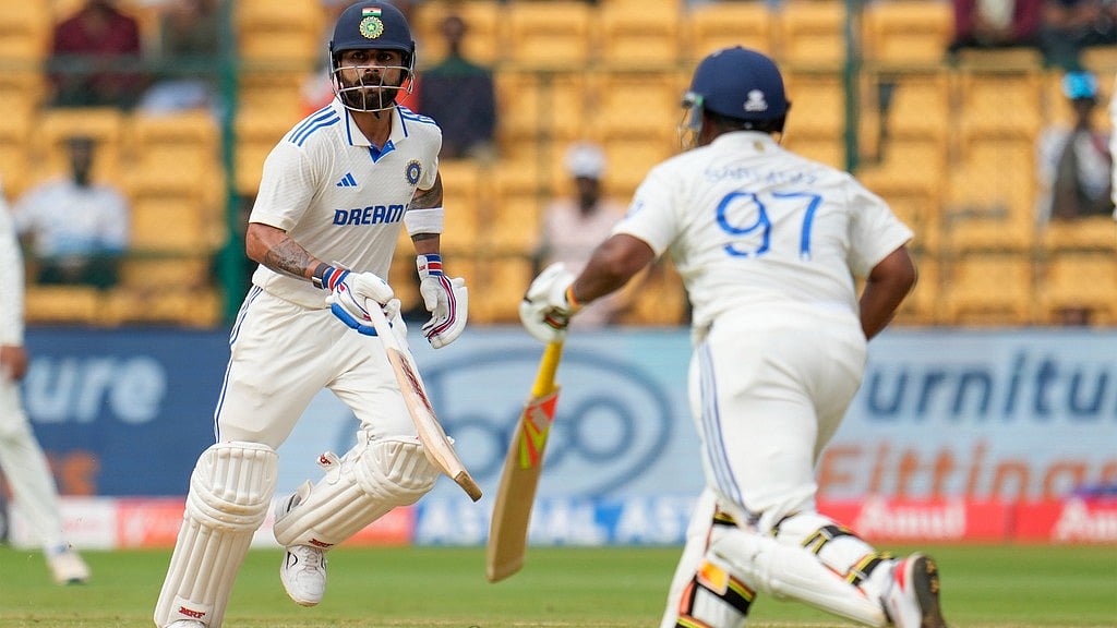 IND vs NZ, 1st Test: Virat Kohli (left) and Sarfaraz Khan in action against New Zealand on Day 3 in Bengaluru. - Photo: AP