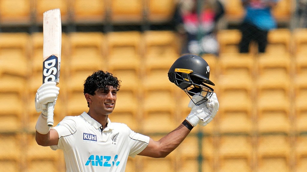 AP/Aijaz Rahi : IND Vs NZ, 1st Test: Rachin Ravindra celebrates his second Test ton in Bengaluru.
