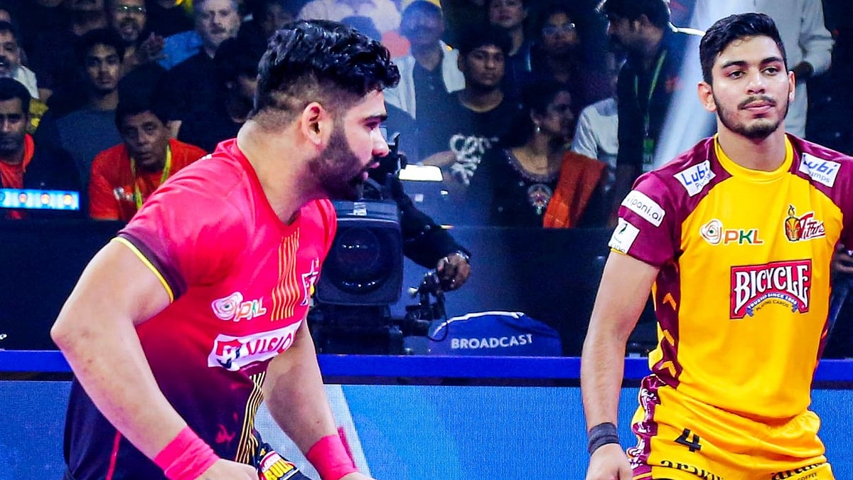 X/Bengaluru Bulls : Bengaluru Bulls' Pardeep Narwal (left) in action against Telugu Titans during Pro Kabaddi League season 11.