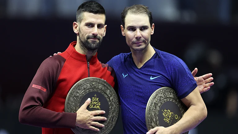 Novak Djokovic and Rafael Nadal pose together after their match at the 6 Kings Slam - null