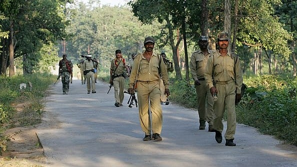 Getty Images : police officers patrolling the naxal infested forests at Bijapur near Dantewada