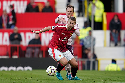 EPL 2024-25: Manchester United's Matthijs de Ligt, front, duels for the ball with Brentford's Mikkel Damsgaard