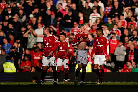 EPL 2024-25: Manchester United's players react after Brentford's Ethan Pinnock scoring his side's opening goal