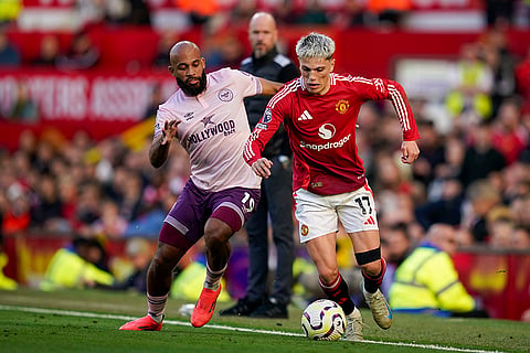 EPL 2024-25: Manchester United's Alejandro Garnacho, right, duels for the ball with Brentford's Bryan Mbeumo