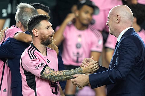 Major League Soccer: Lionel Messi, left, shakes hands with FIFA President Gianni Infantino