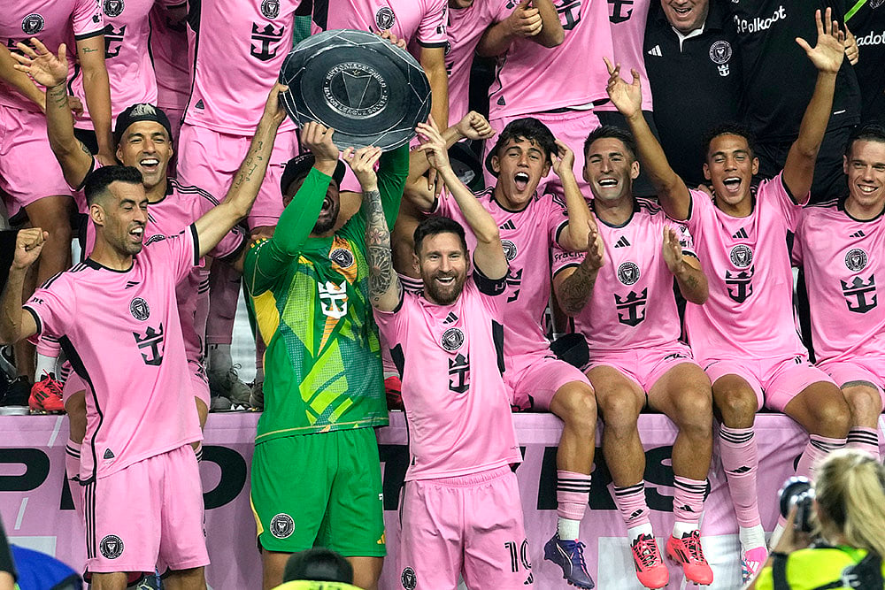 File : Inter Miami forward Lionel Messi celebrates with his teammates winning the Supporters' Shield