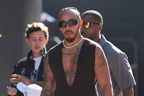F1 US Grand Prix Auto Racing: Lewis Hamilton walks to his garage before a sprint race