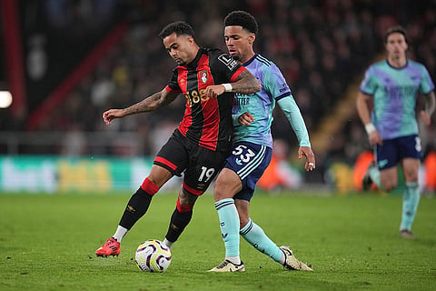 EPL 2024-25: Bournemouth's Justin Kluivert, left, challenges for the ball with Arsenal's Ethan Nwaneri