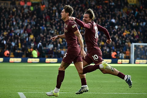 EPL 2024-25: Manchester City's John Stones, left, celebrates with teammate Jack Grealish scoring his side's 2nd goal