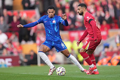 EPL 2024-25: Liverpool's Mohamed Salah, right, challenges for the ball with Chelsea's Levi Colwill 