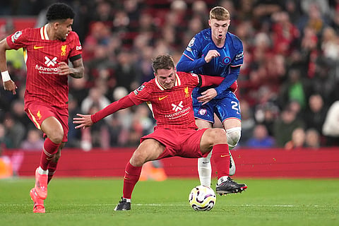 EPL 2024-25: Liverpool's Alexis Mac Allister, centre, challenges for the ball with Chelsea's Cole Palmer