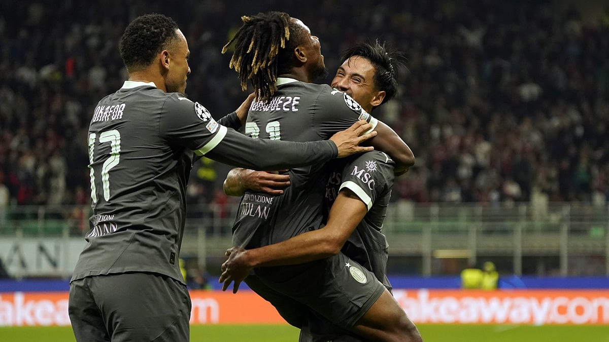 AC Milan players celebrating.