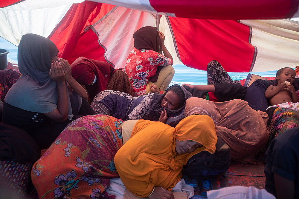 Rohingya refugees: refugees rest in their boat anchored boat