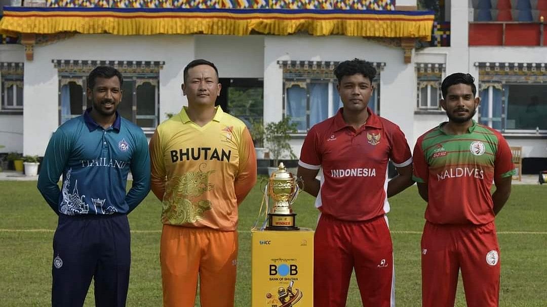 Photo: X | Bhutan Cricket Official : Four finalist team captains during a photoshoot with the trophy.