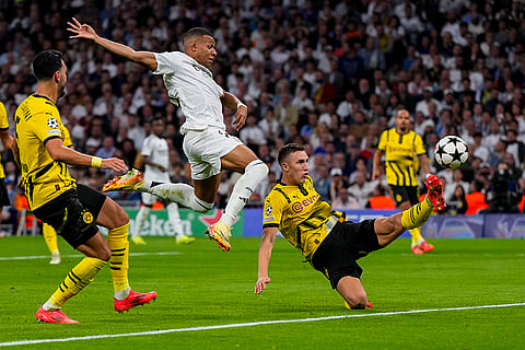 Champions League 2024-25: Dortmund's Nico Schlotterbeck, right, vies for the ball with Real Madrid's Kylian Mbappe