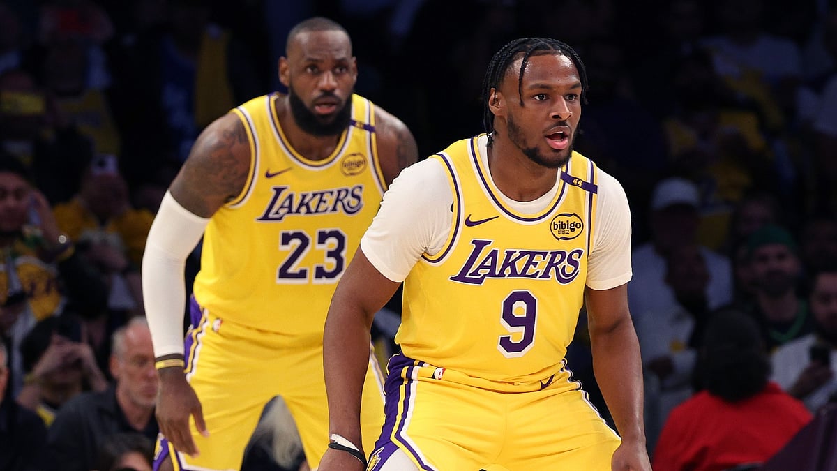 LeBron James #23 and Bronny James #9 of the Los Angeles Lakers on defense during the second quarter against the Minnesota Timberwolves at Crypto.com Arena on October 22, 2024 in Los Angeles, California.