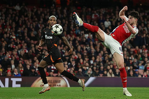 Champions League 2024-25: Arsenal's Declan Rice, right, kicks the ball