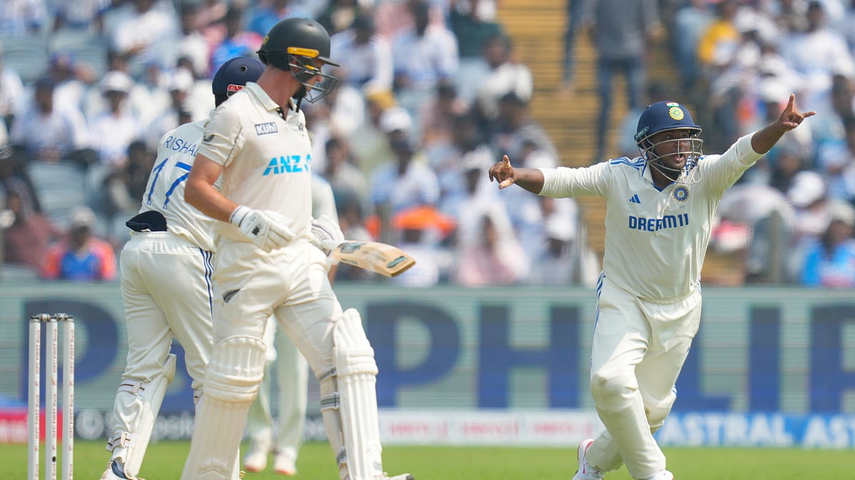 AP Photo/Rafiq Maqbool : India's Sarfaraz Khan, right, appeals for the wicket of New Zealand's Will Young, left, during day one of the second cricket test match between India and New Zealand at the Maharashtra Cricket Association Stadium, in Pune.