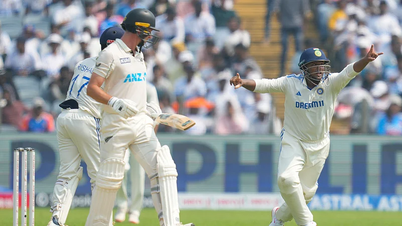 Indias Sarfaraz Khan, right, appeals for the wicket of New Zealands Will Young. AP Photo