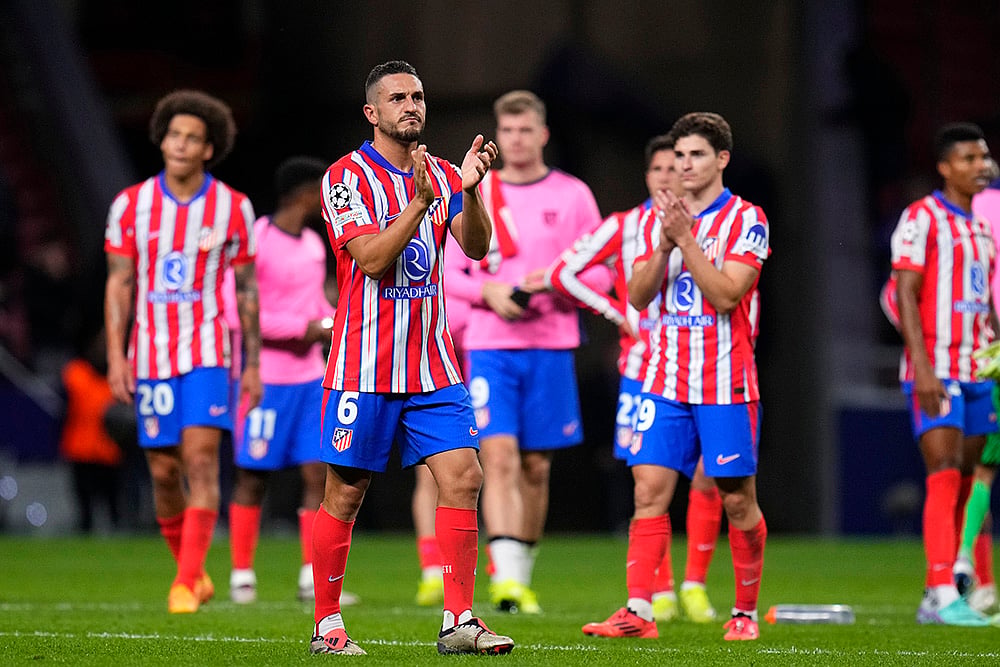 | Photo: AP/Manu Fernandez : Champions League 2024-25: Atletico Madrid's players walk off the pitch after the match against LOSC Lille