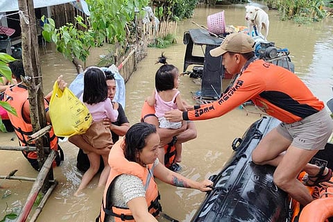 Tropical Storm Trami: Philippine Coast Guard rescue residents trapped in their home after floods