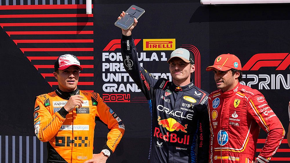 | Photo: AP/Eric Gay : F1 US Grand Prix Auto Racing: Max Verstappen, center, strands with Lando Norris, left, and Carlos Sainz right after winning a sprint race