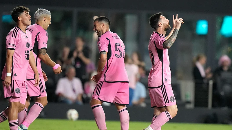 Inter Miami forward Lionel Messi, right, reacts after scoring his third goal. AP Photo