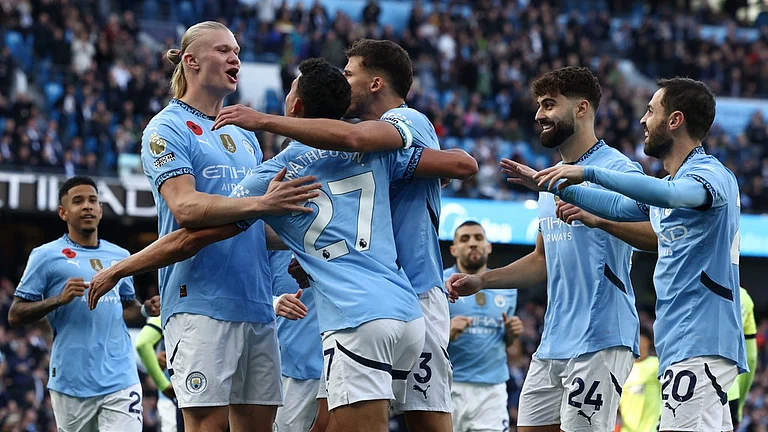 Manchester City's Erling Haaland celebrates with teammates after scoring his side's opening goal during their English Premier League match against Southampton at the Etihad Stadium in Manchester. - AP/Darren Staples