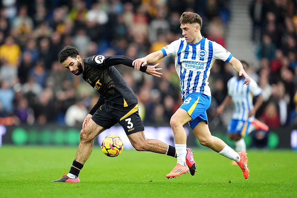 | Photo: Adam Davy/PA via AP : EPL 2024-25: Wolverhampton Wanderers' Rayan Ait-Nouri, left and Brighton's Brajan Gruda vie for the ball