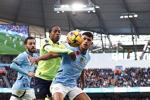 EPL 2024-25: Manchester City's Matheus Nunes, right, duels for the ball with Southampton's Kyle Walker-Peters 