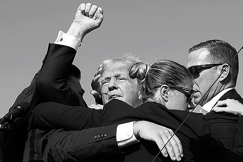 Close Shave: Republican presidential candidate Donald Trump rushed offstage by Secret Service agents after being grazed by a bullet during a rally in July