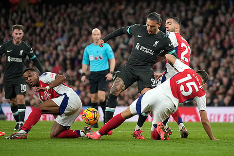 Premier League 2024-25:  Liverpool's Darwin Nunez, centre, challenges for the ball with Arsenal's Jakub Kiwior