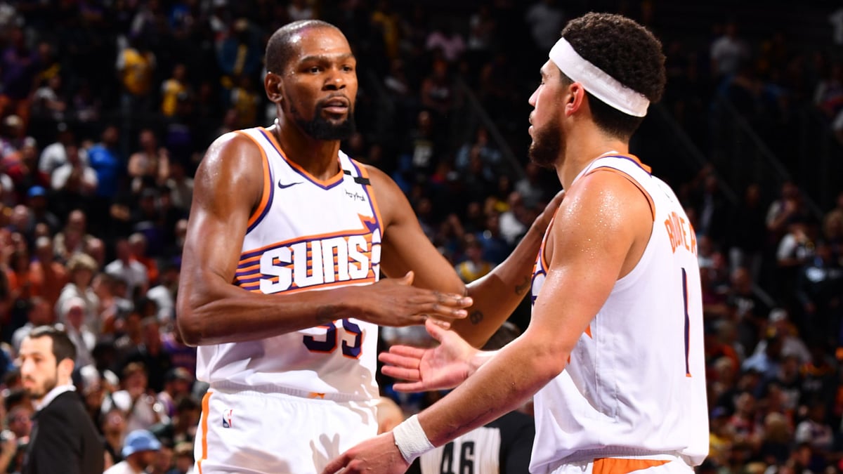 Kevin Durant (left) and Devin Booker of the Phoenix Suns congratulate one another vs. the Los Angeles Lakers on Oct. 28, 2024.